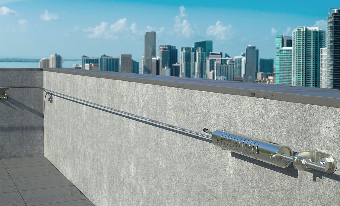 Engineered horizontal lifeline anchor installed on concrete parapet roof for fall protection